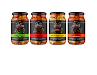 Four jars of pickled peppers with labels on a white background